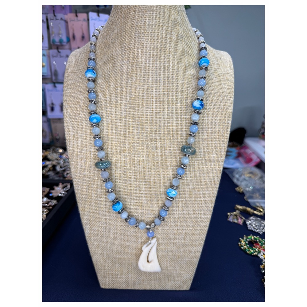 Blue Beaded Necklace with Carved White Hook Pendant and Toggle Clasp